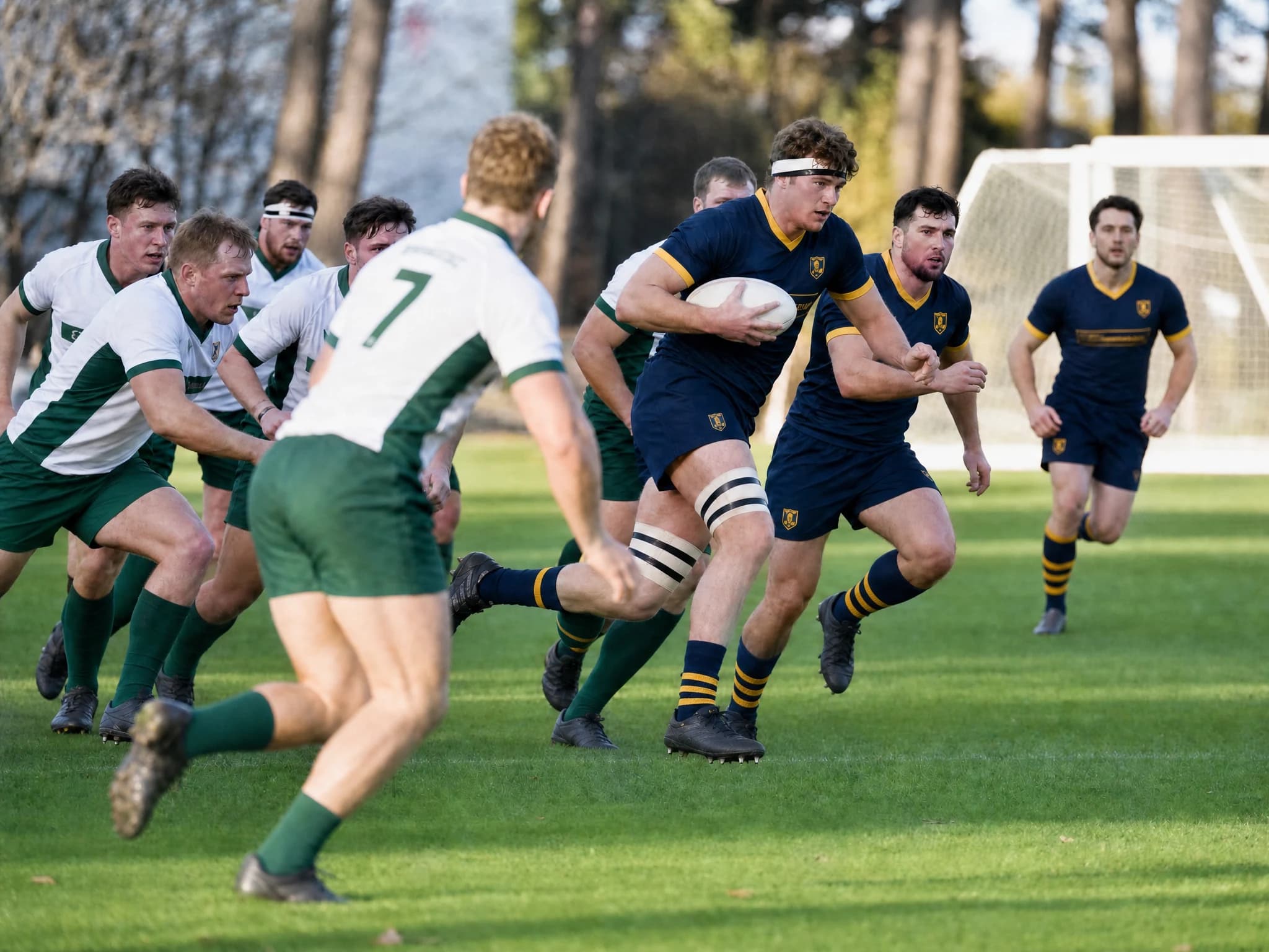 A ball carrier in navy and gold with a headband driving into a defence in white and green